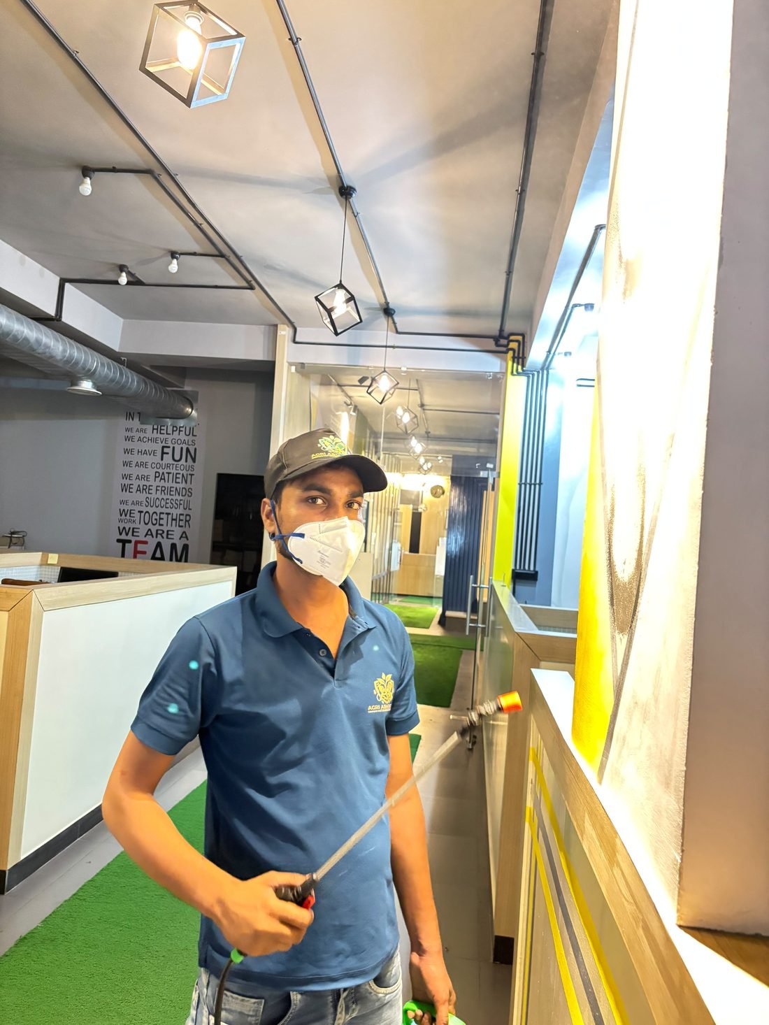 Agri ABM Pvt Ltd technician performing pest control treatment in a corporate reception area